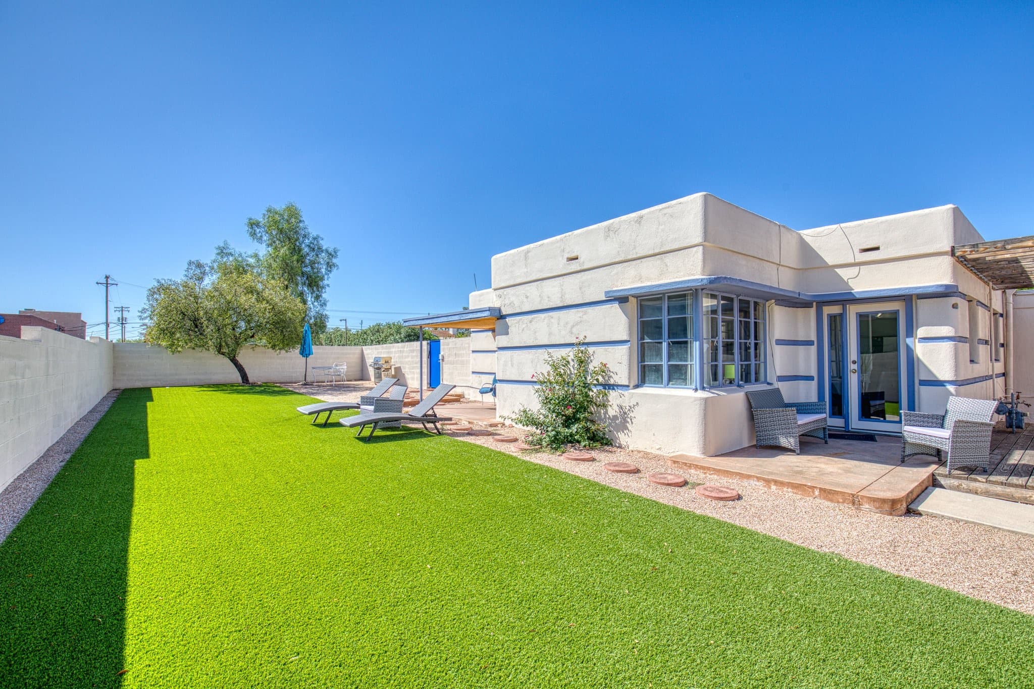 Backyard with turf lawn and patio